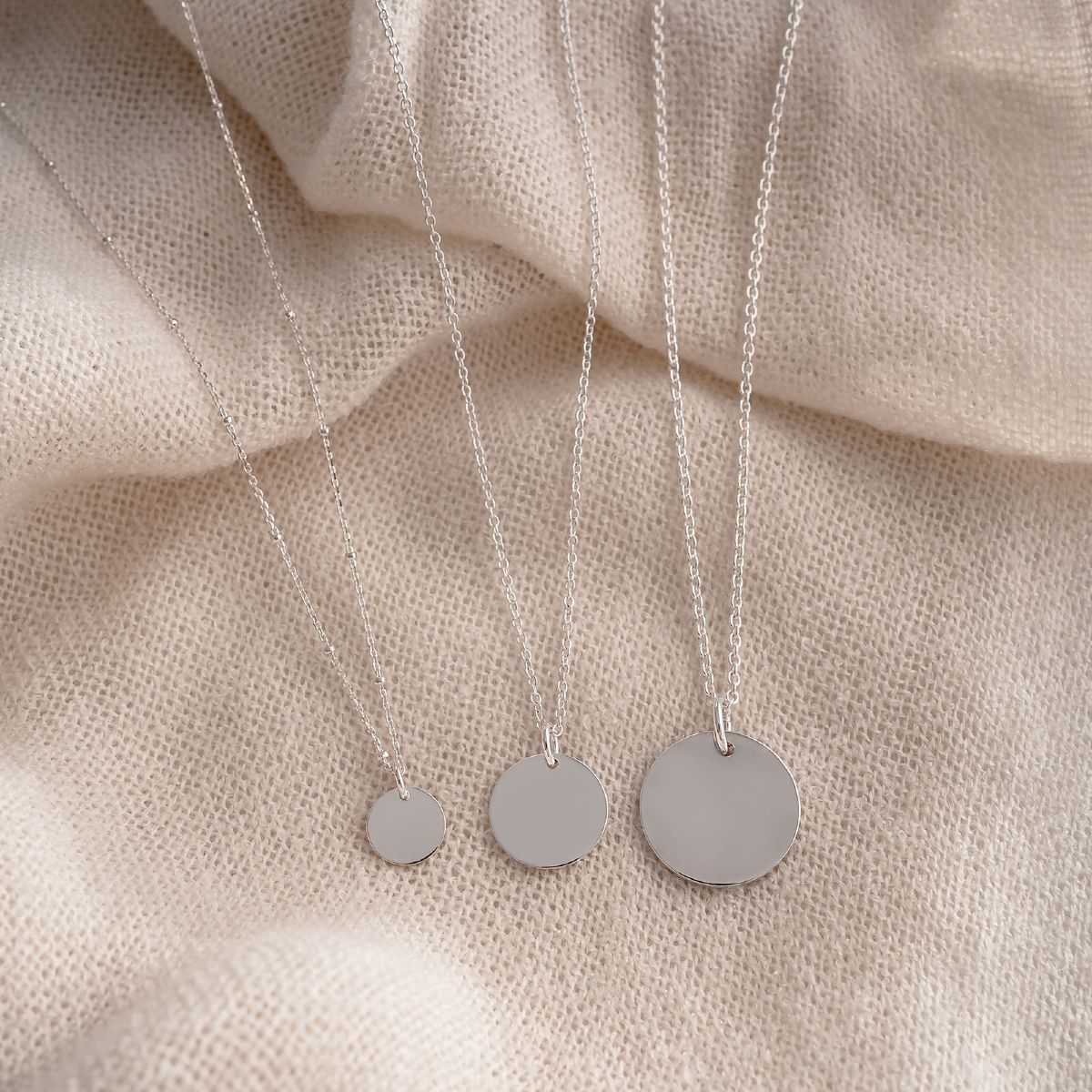 engrave these 10mm, 155mm and 20mm disc necklaces