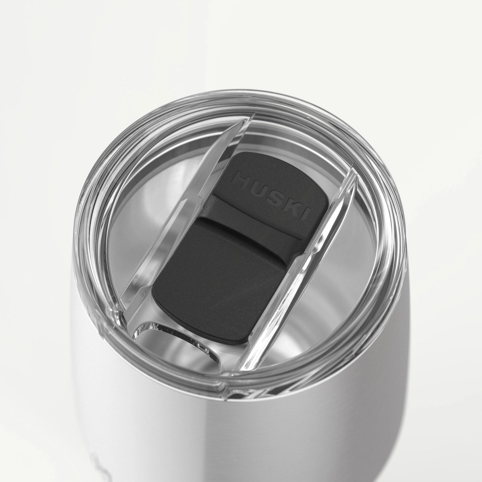 Close-up of Huski Tumbler lid showing EasySlider spill-proof feature