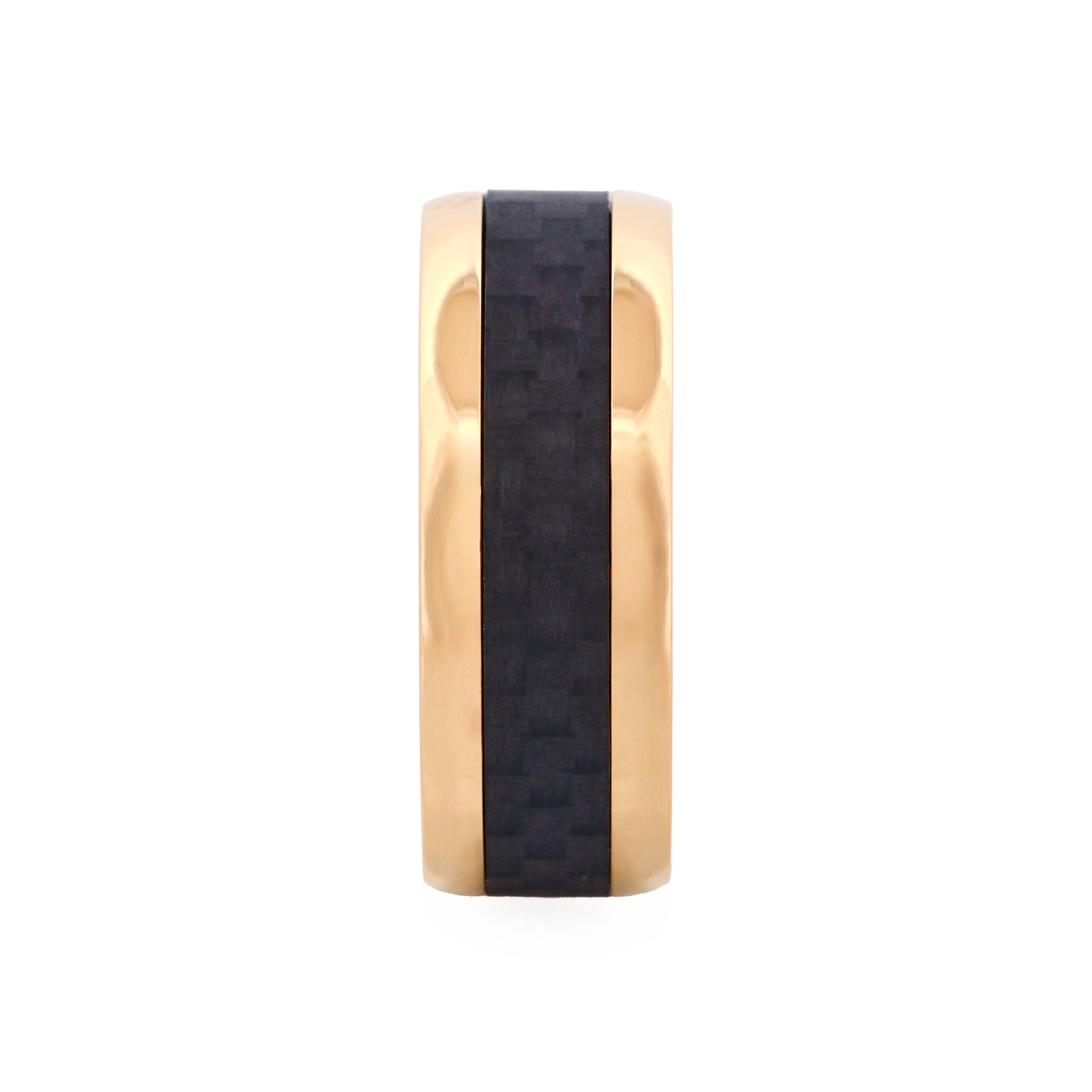 engraved Gold ring with a black band on a white background