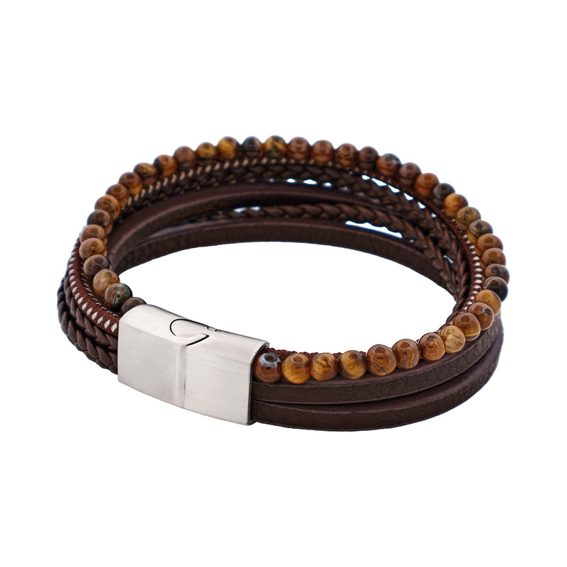 Brown leather and beaded bracelet with a silver clasp on a white background