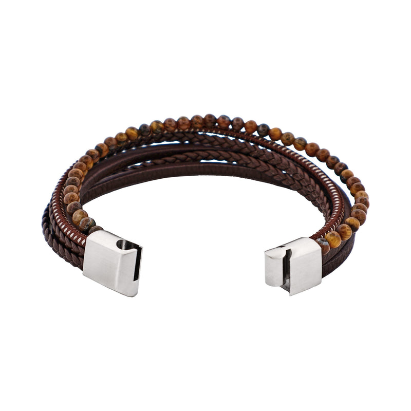 Multistrand leather and bead bracelet with metal clasps on a white background