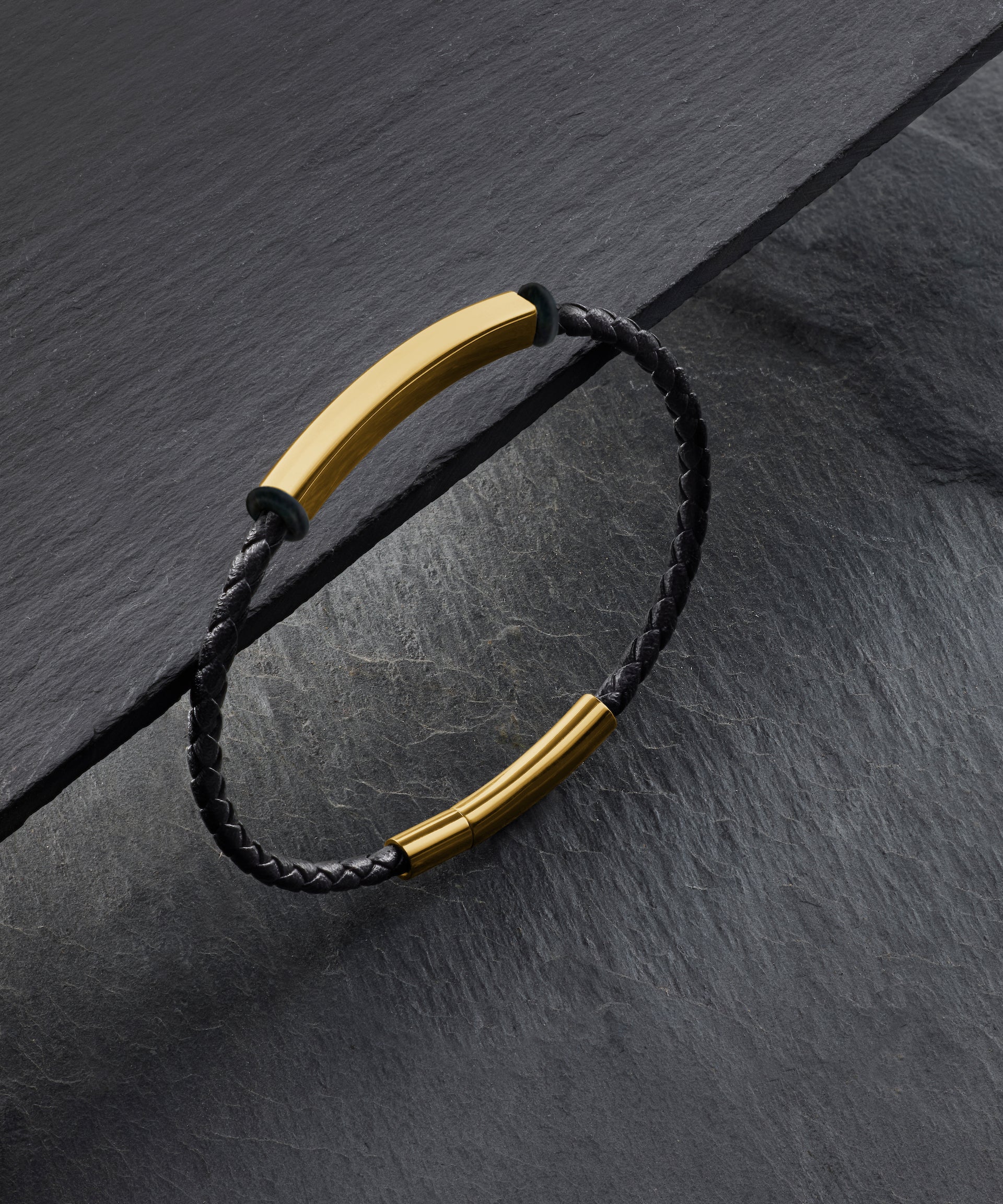Engrave a name or date on this  Woven Leather Bracelet — Gold Steel Edition