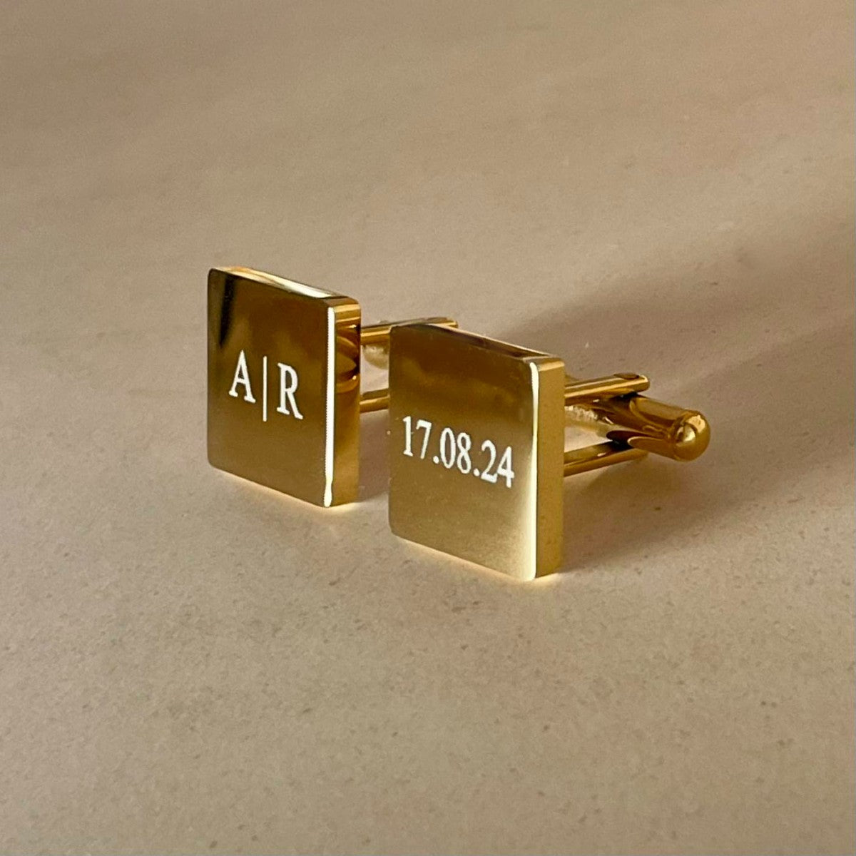 gold square cufflinks with initial and date