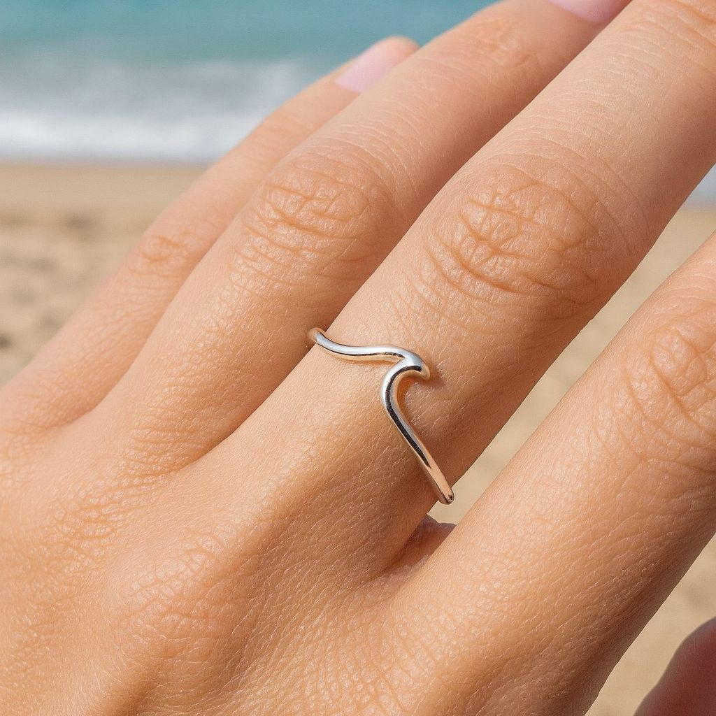 sterling silver wave ring on index finger
