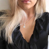 T engraved on lock pendant