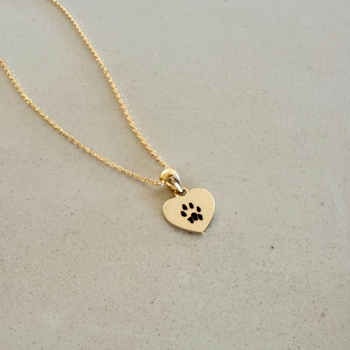 cat paw engraved on solid gold mini heart pendant