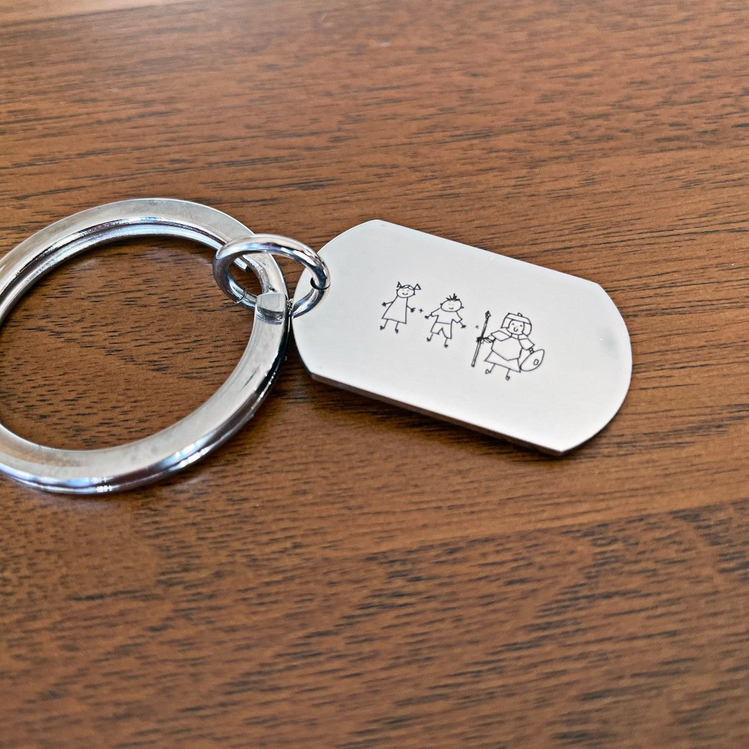 keyring engraved with drawing of family