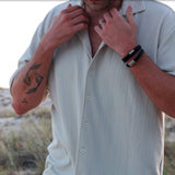 Personalised black leather bracelet with brushed silver clasp, engraved gift for him from The Silver Store