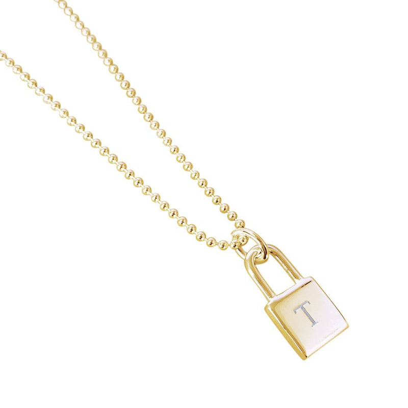 gold ball chain and lock pendant engraved with a T