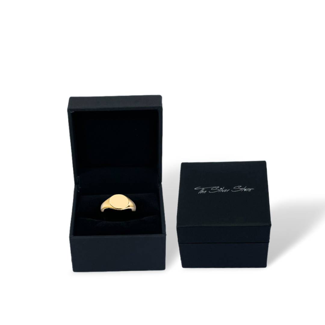 gold signet ring in gift box