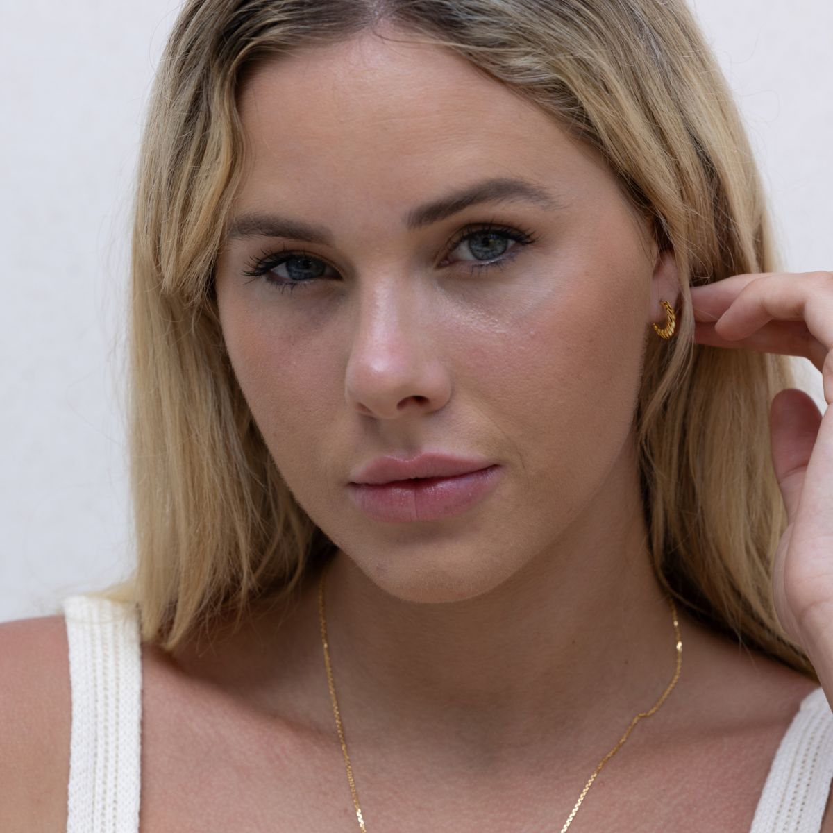 gold croissant twist huggie  hoop earrings