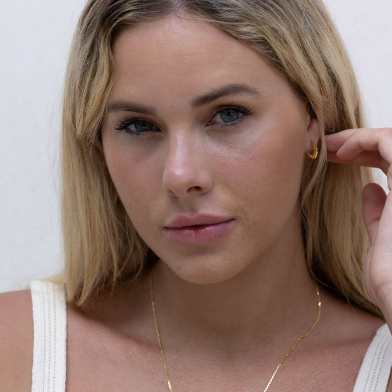 gold croissant twist huggie  hoop earrings