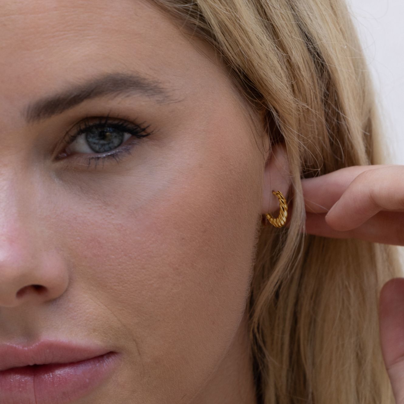 gold croissant twist huggie  hoop earrings