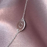 initial disc bracelet with letter G engraved