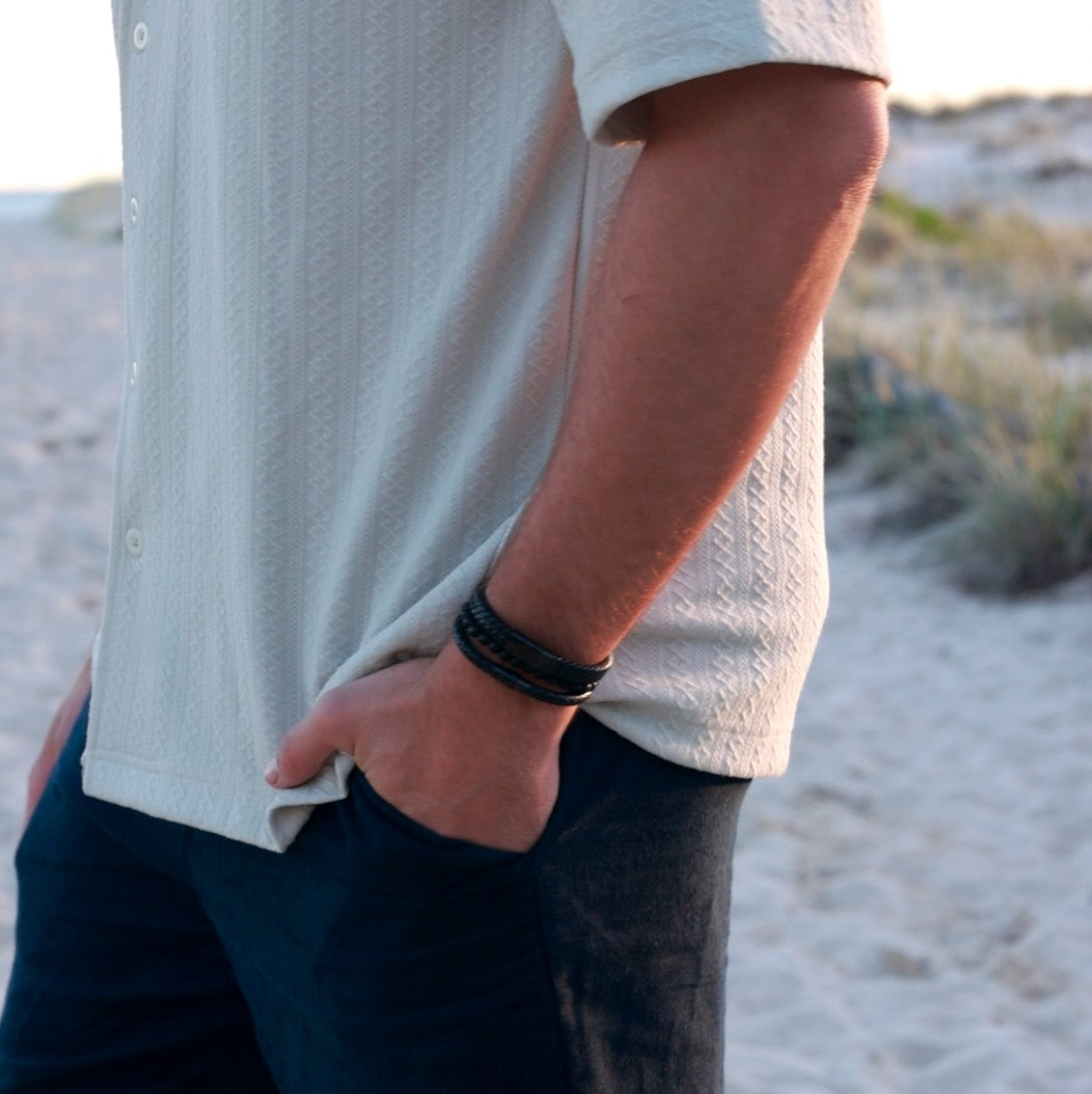 Men’s black leather bracelet stack with personalised engraving option, available at The Silver Store