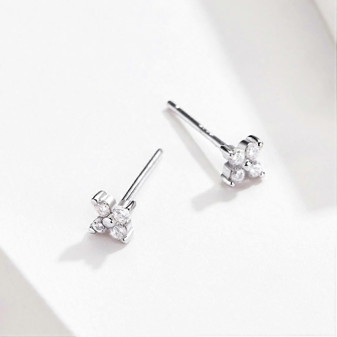 mini flower stud earrings made from sterling silver and cubic zirconia 