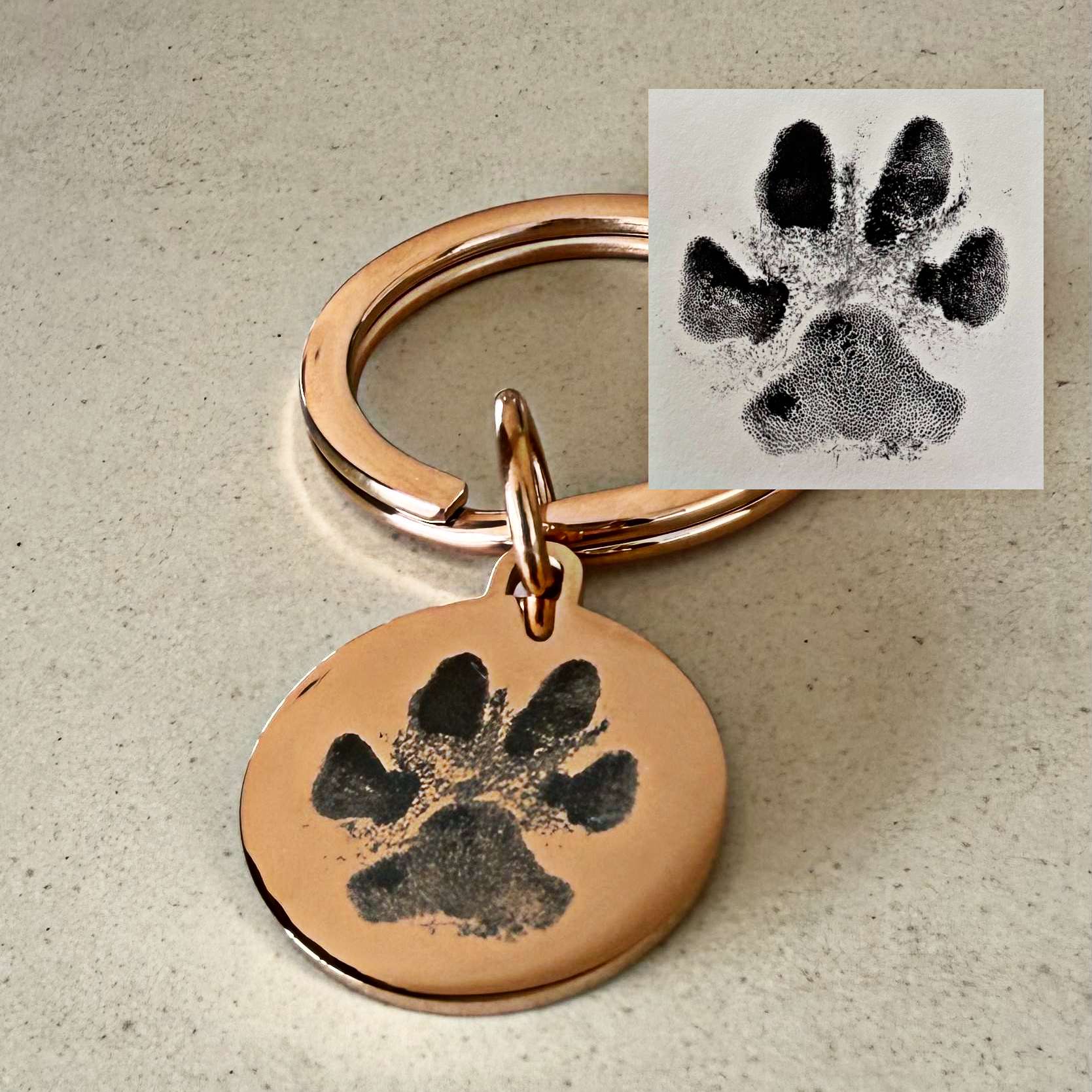 paw print engraved on rose gold disc keyring