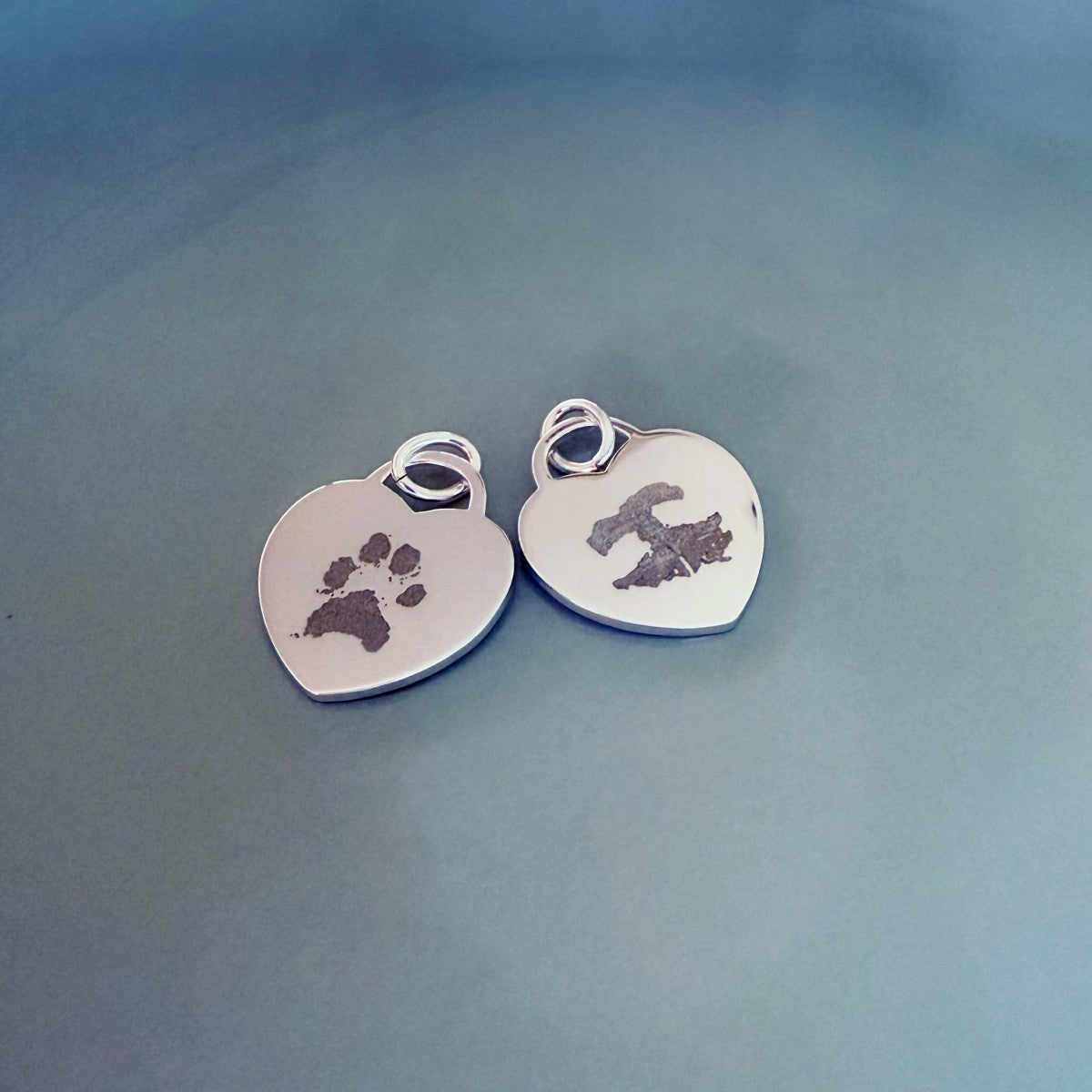 pet paw print and nose print engraved on silver heart tag pendant