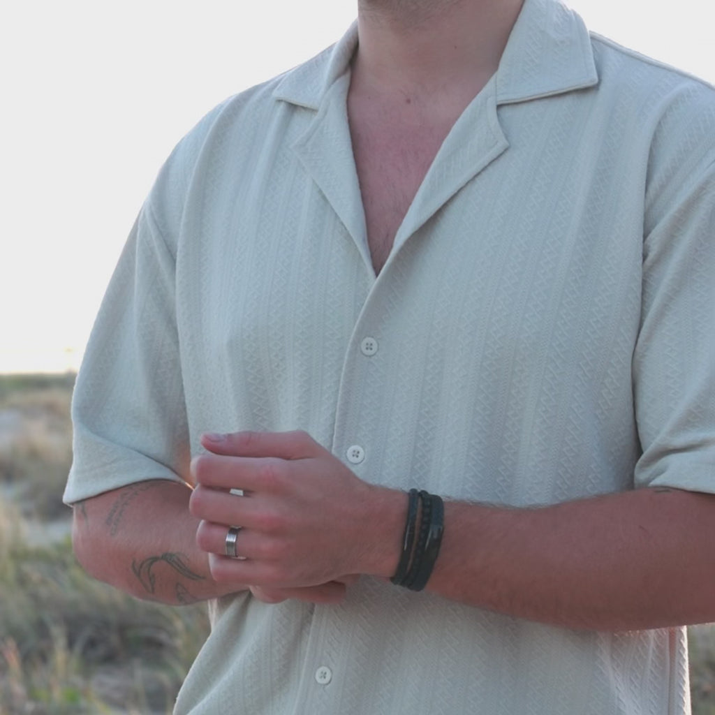 Video of men's all black leather bracelet stack from The Silver Store, showcasing three layered bracelets including one engravable bracelet for personalised engraving