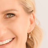 rose gold mini disc hoop earrings closeup