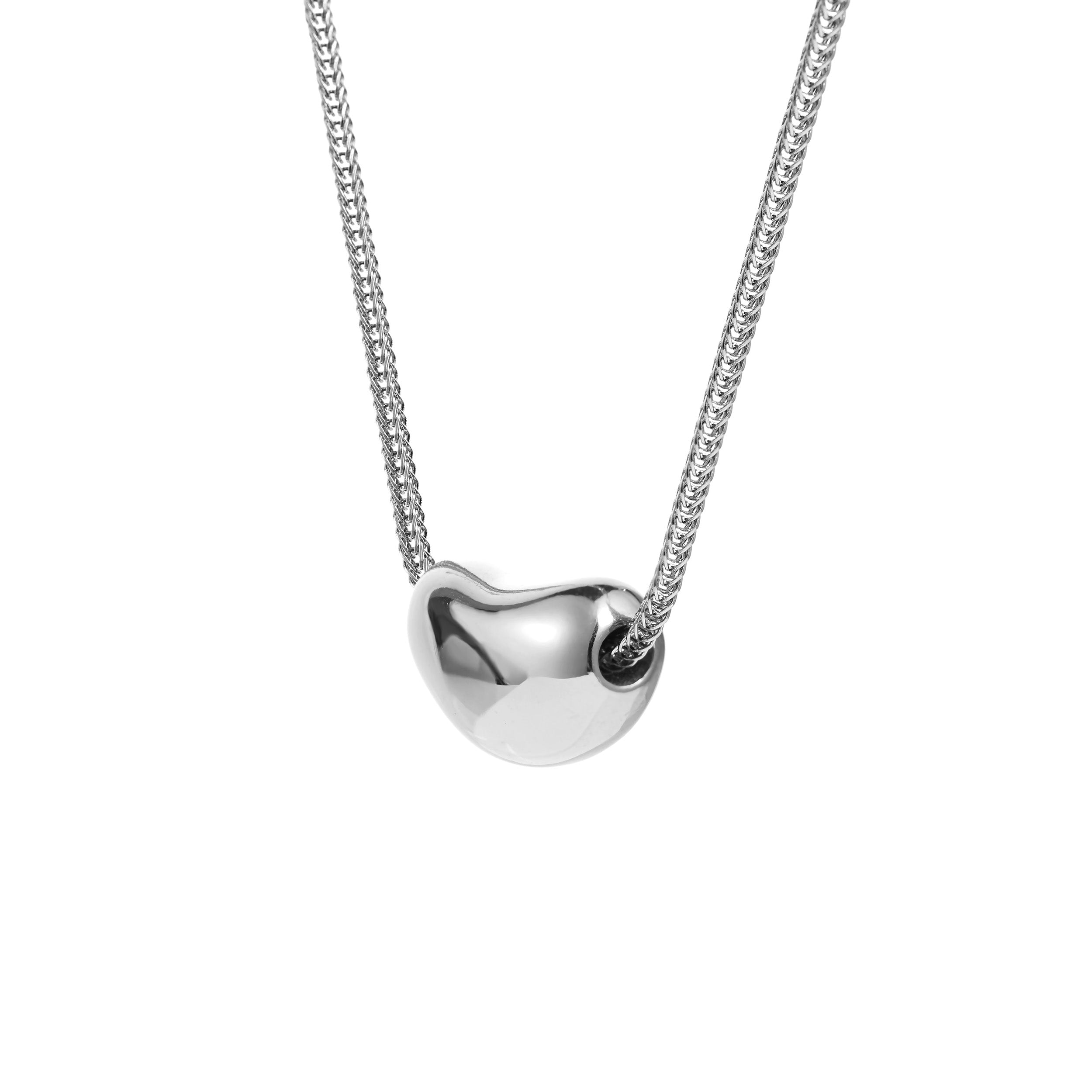 side view of silver bean shaped pebble pendant 