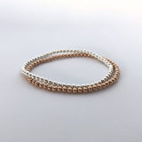 silver and rose gold stretch bead bracelet