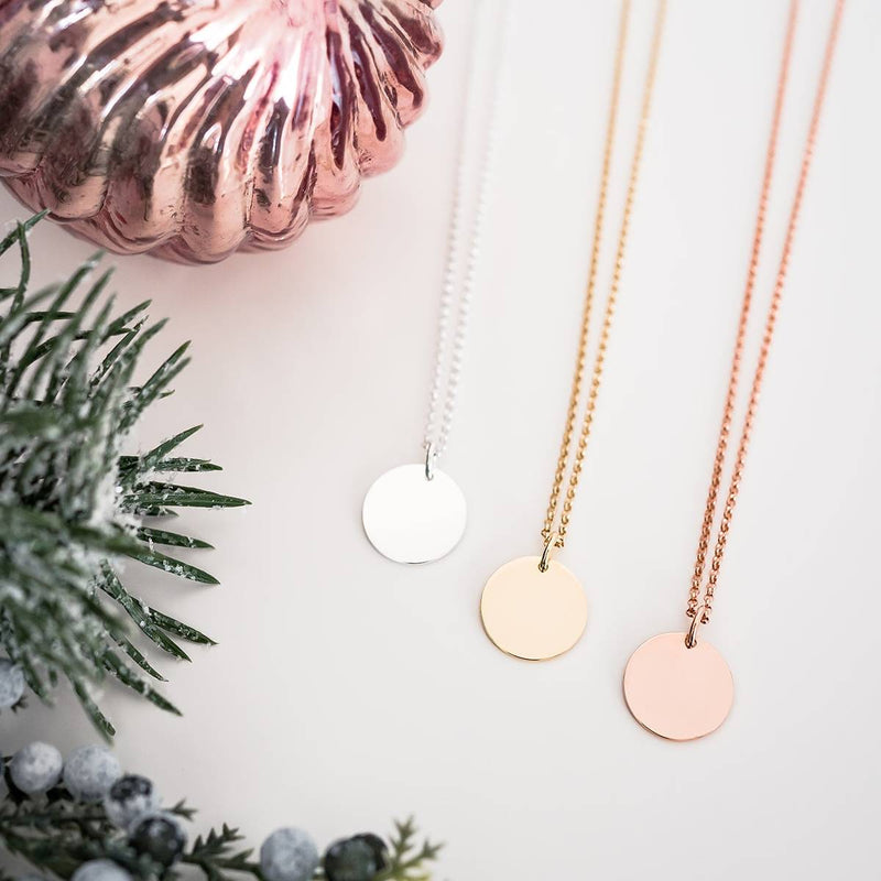 silver, gold and rose gold disc necklace with letter engraved