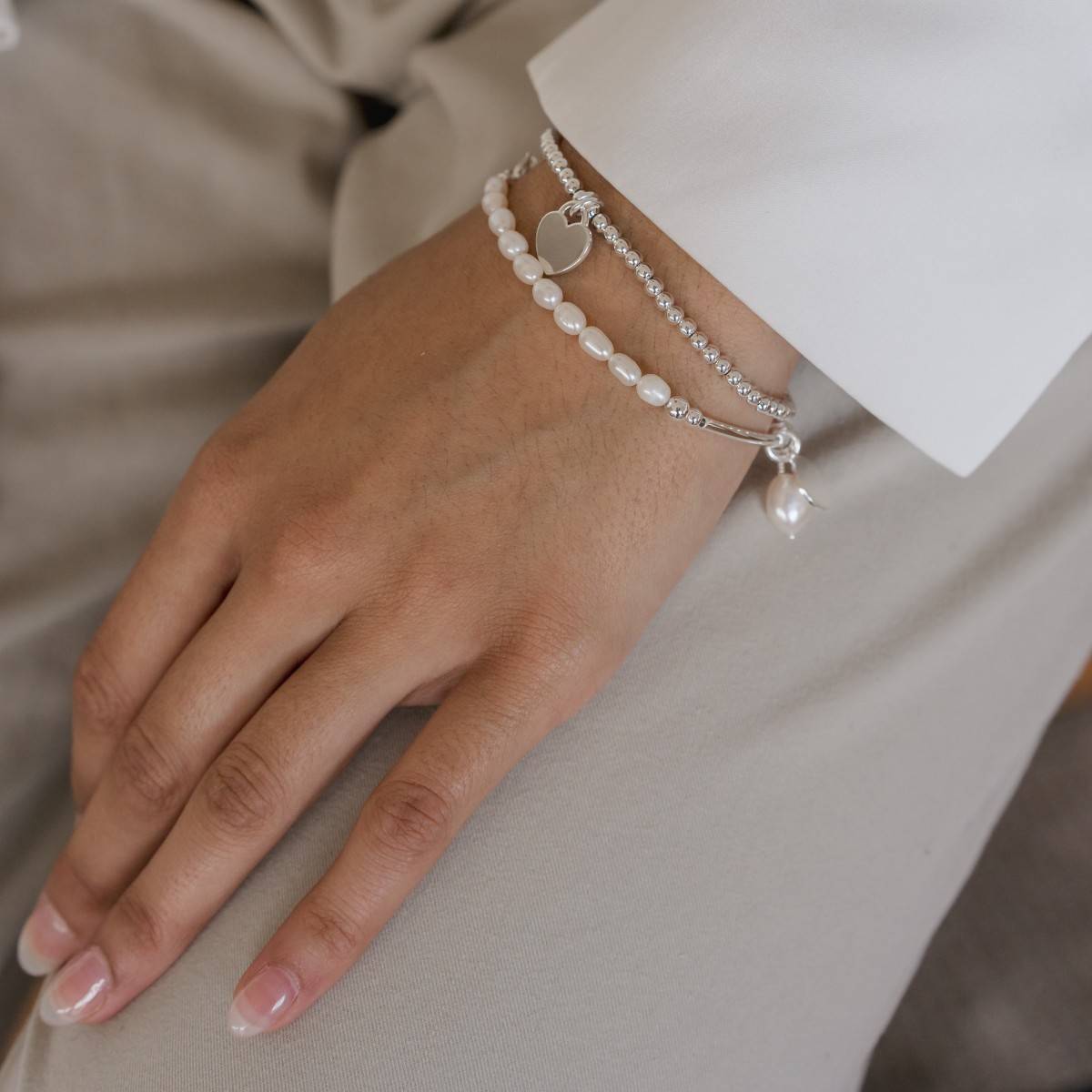 silver stretch bead bracelet with mini heart