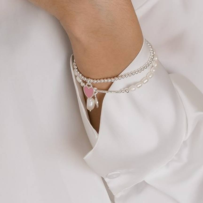 stretch bracelet with heart pendant and pearl bracelet