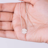 suspended 10mm disc bracelet in hand