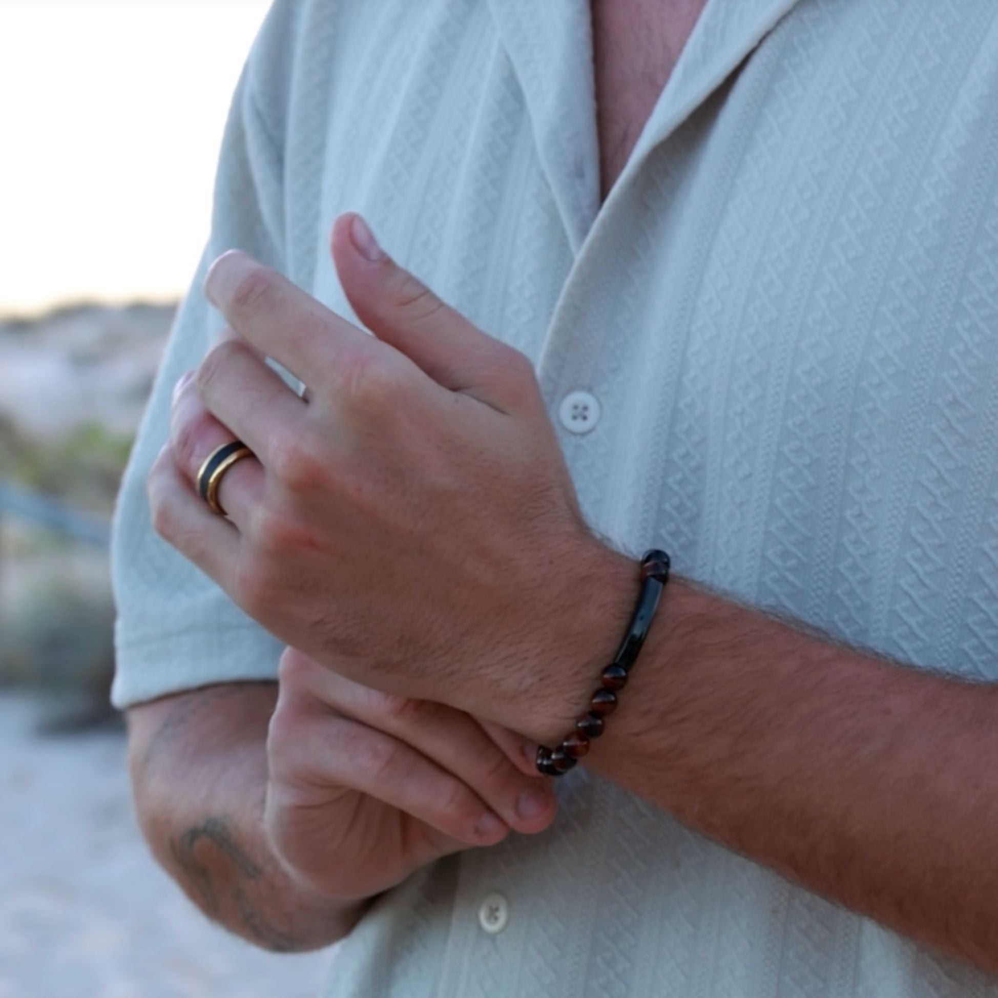Men’s Tiger’s Eye beaded bracelet with engraved stainless steel bead, available at The Silver Store