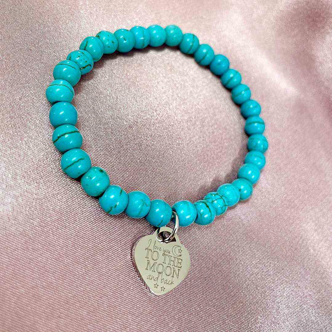 turquoise stretch bead bracelet with engraved heart pendant