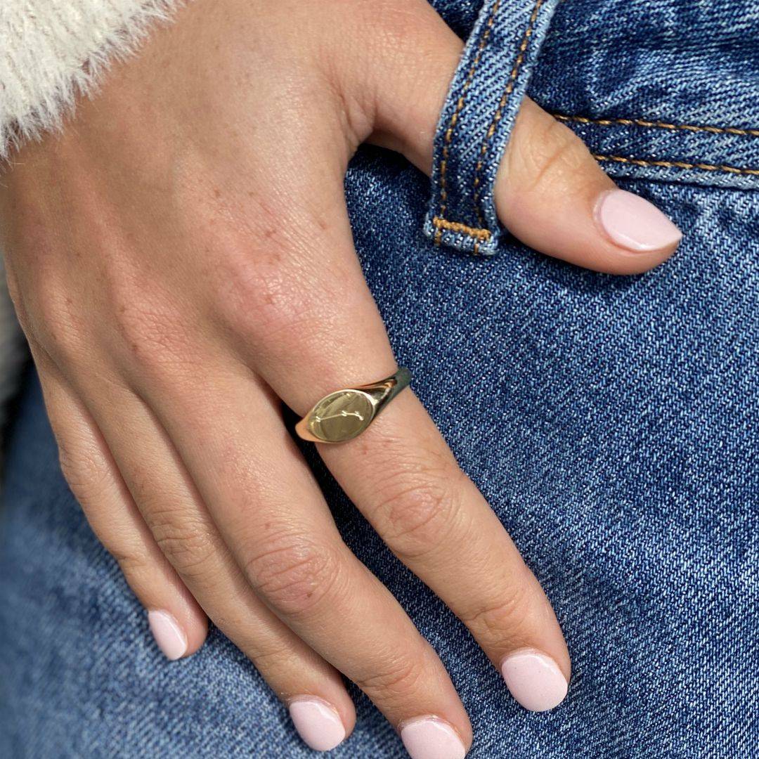 yellow gold signet ring with aries constellation engraved