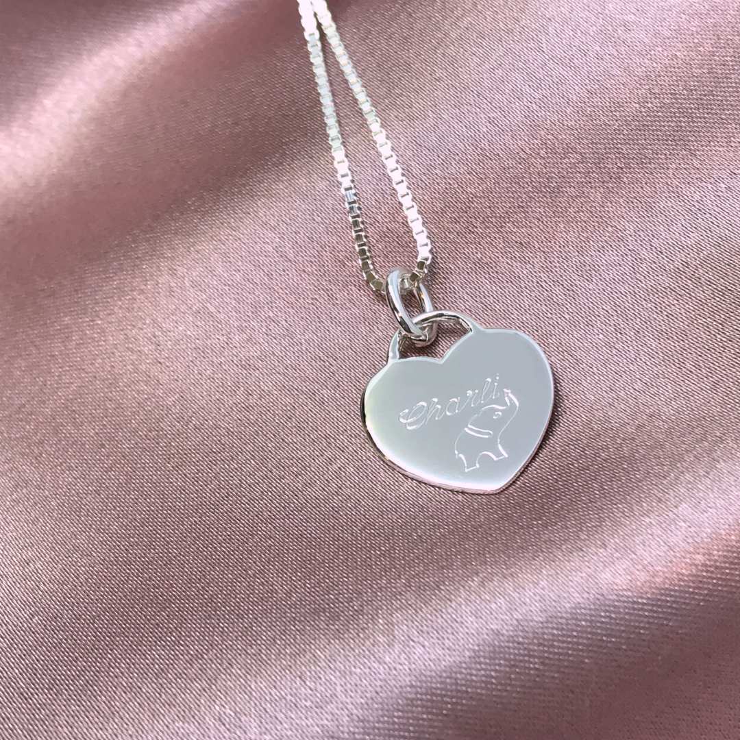 silver heart tag pendant engraved with luck elephant