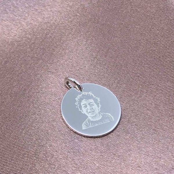 child's photo engraved on silver disc pendant