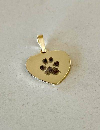 solid gold heart pendant with paw print engraved