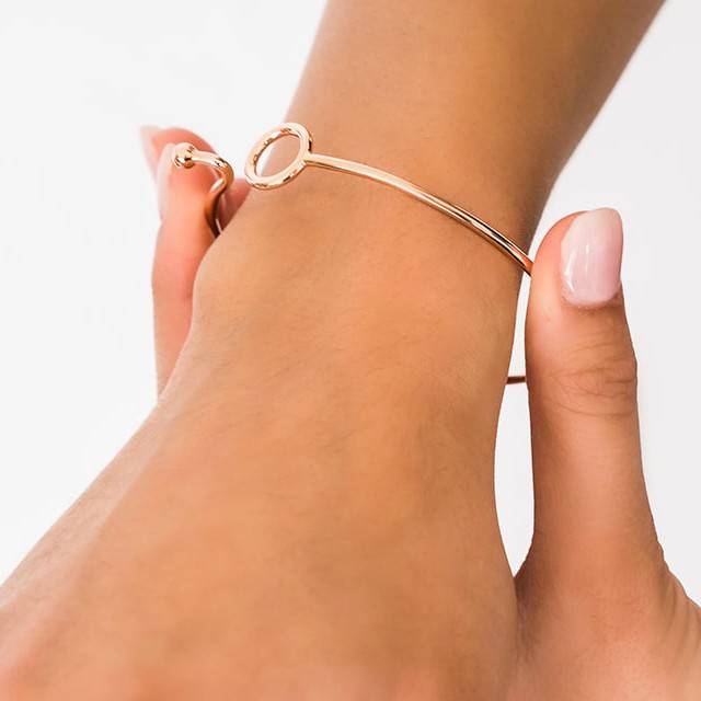 ose gold bangle can be slipped onto wrist