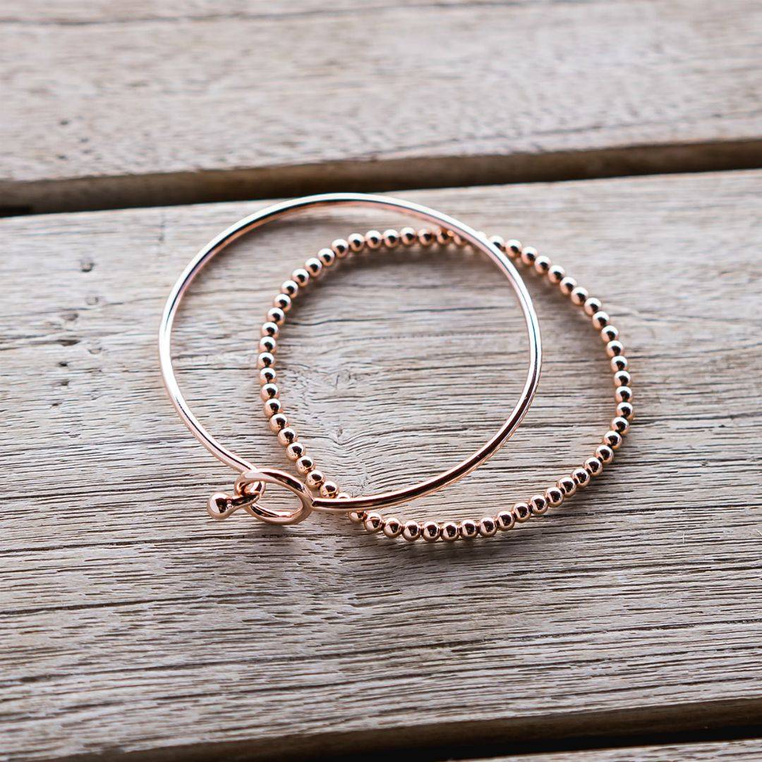 rose gold opening bangle and stretch bead bracelet