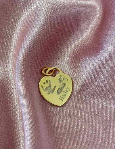 fingerprint and handprint engraved on gold heart tag pendant