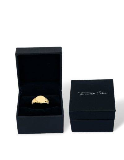 gold signet ring in gift box