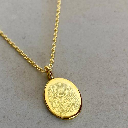 fingerprint engraved on gold plated oval necklace