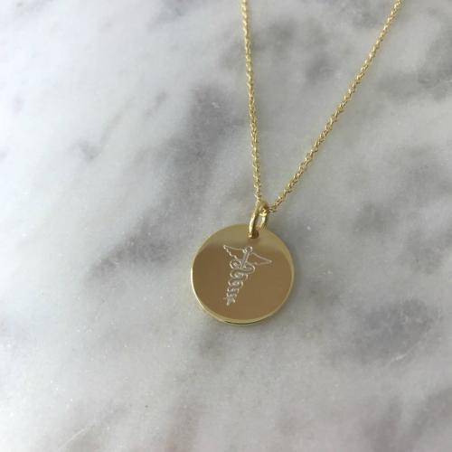yellow gold disc necklace with medic symbol engraved